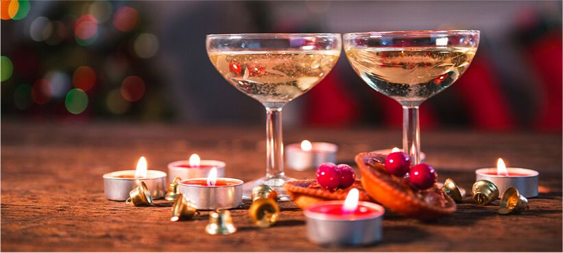 Non-alcoholic wine with festive background.